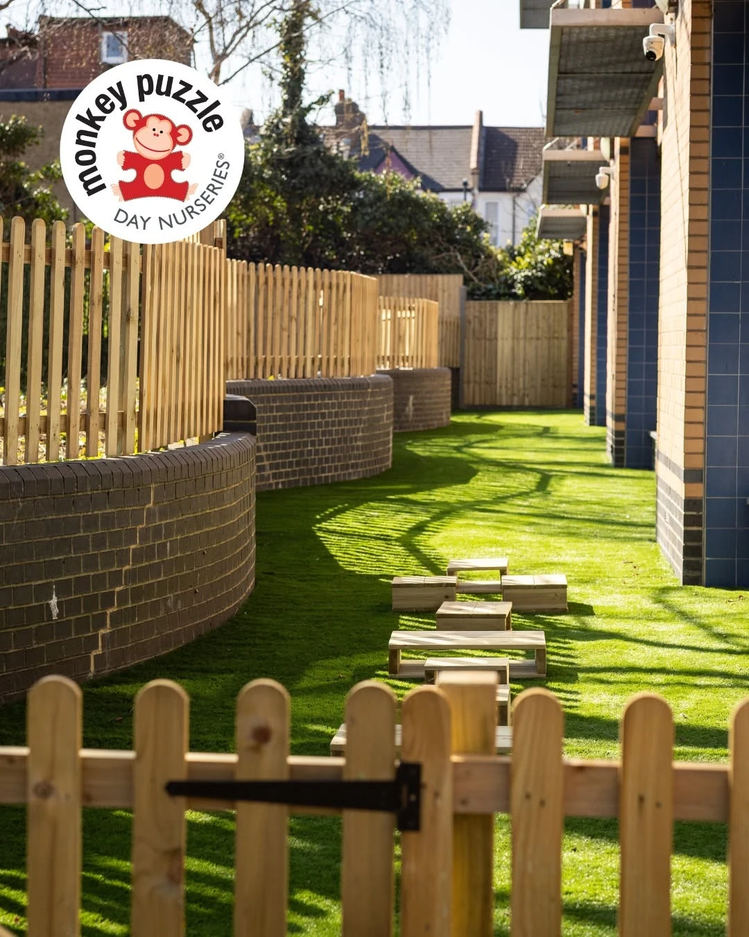 Stepping-stone path and low timber fencing in the nursery garden