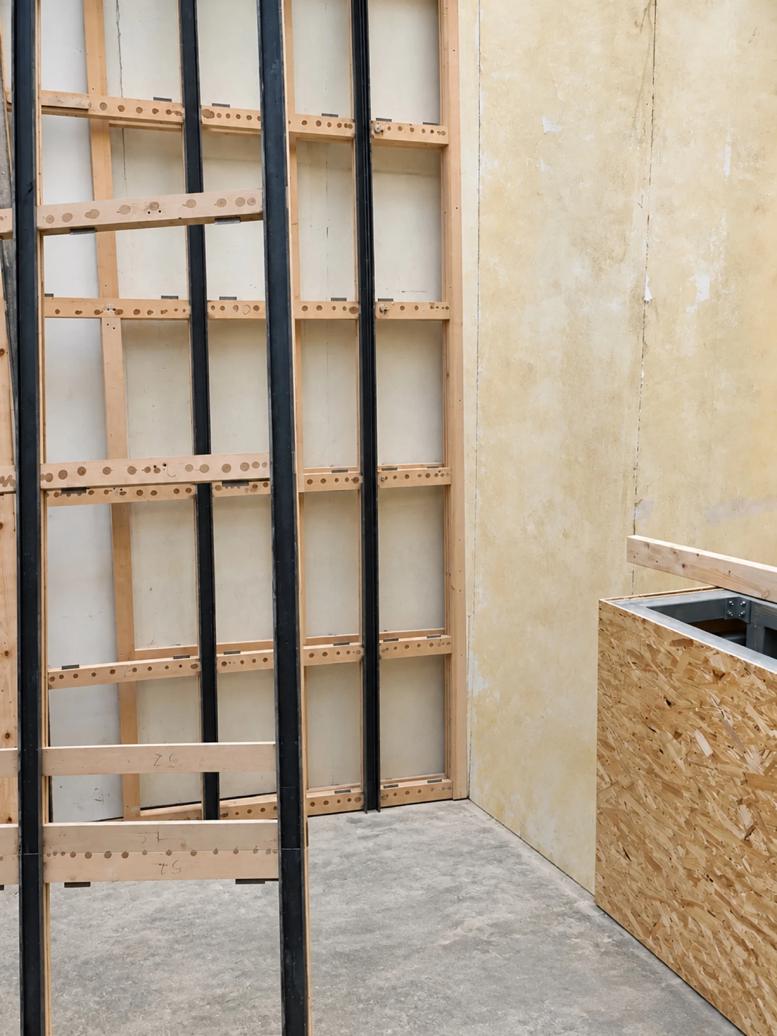Work in progress: framing and service routes within the gallery.