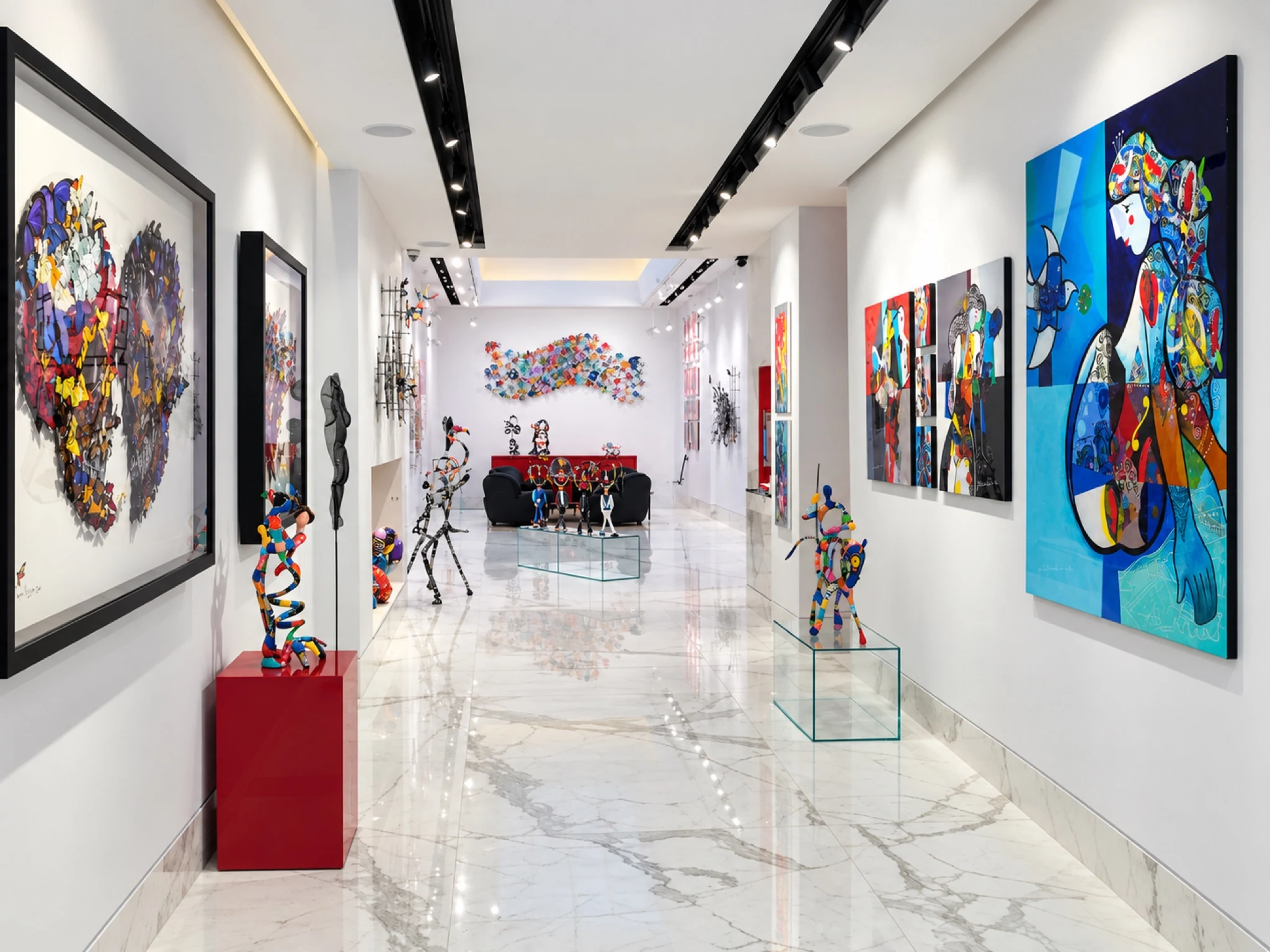 The finished gallery: a bright exhibition corridor with tiled floors and track lighting.