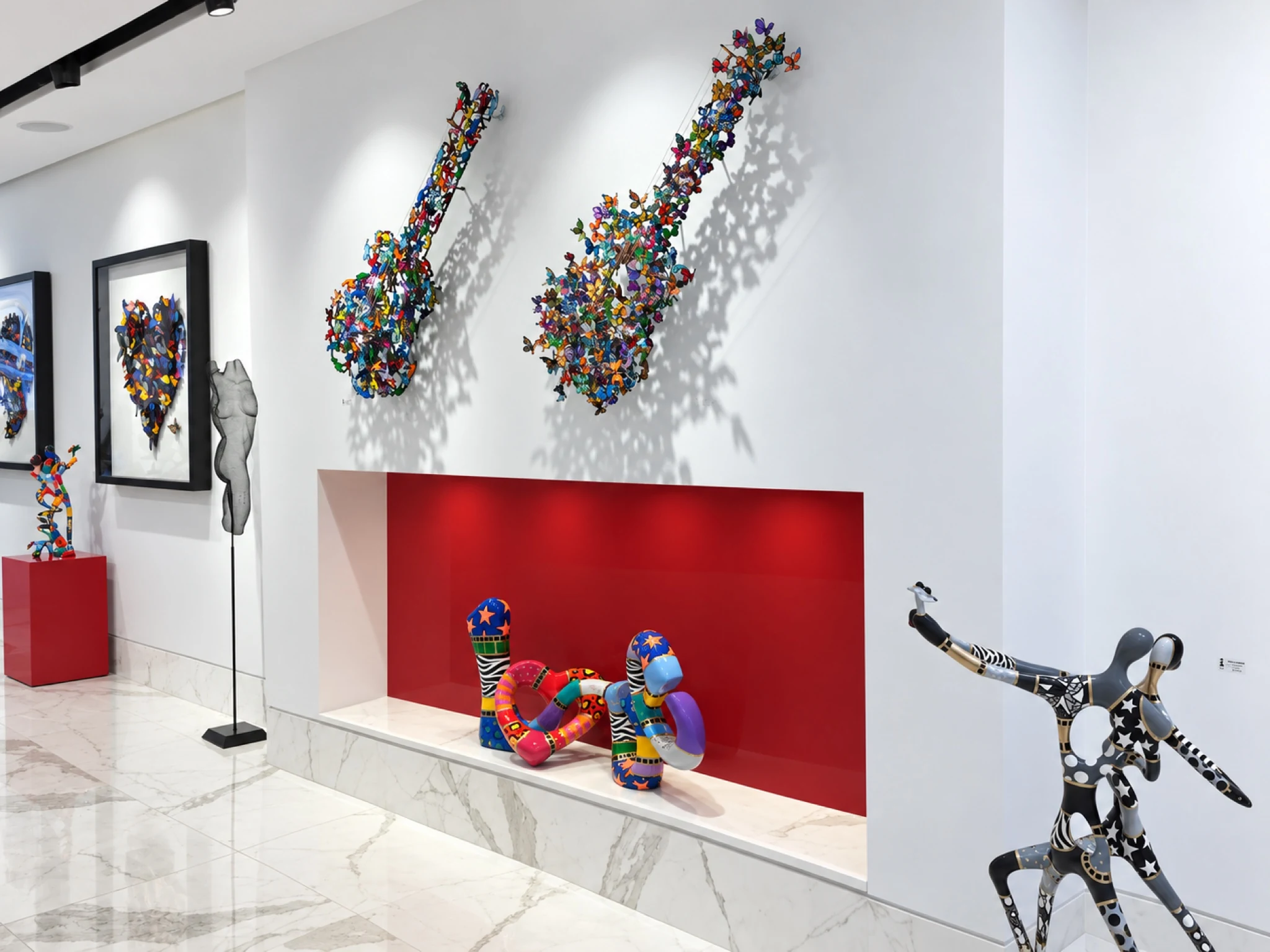 Wall displays and plinths within the completed gallery.