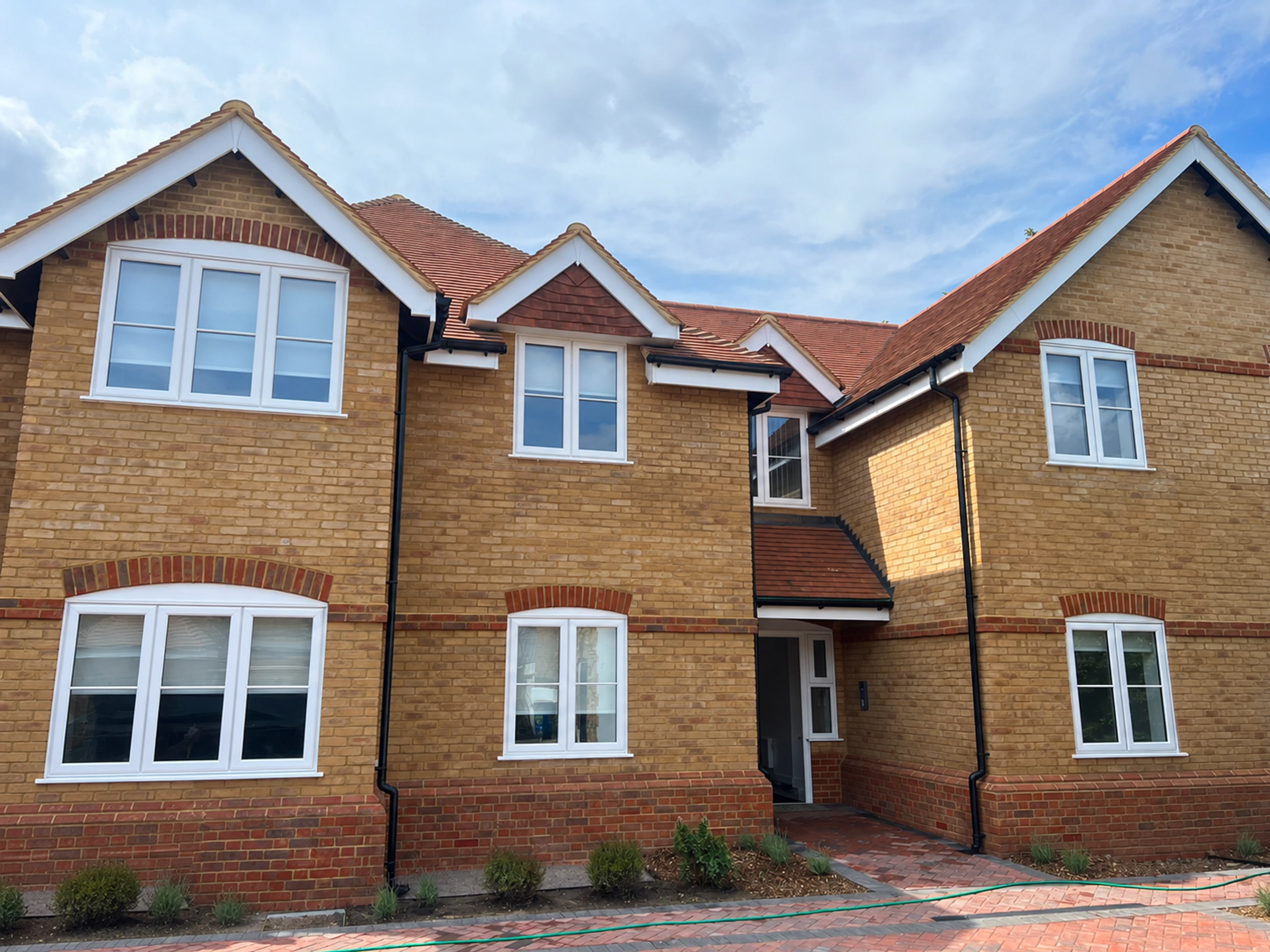 The completed brick exterior, tiled roof and entrance.