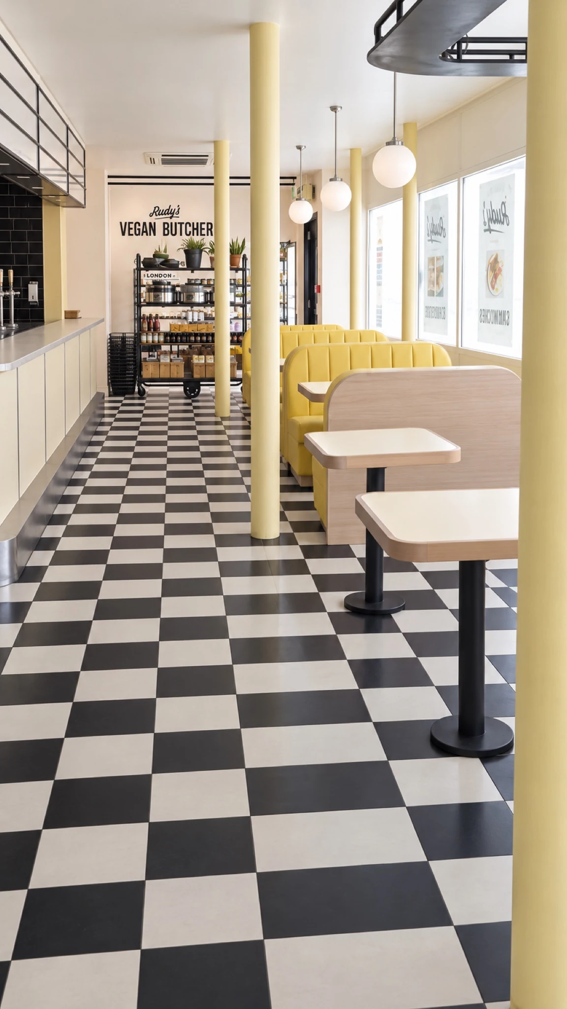 Window-side seating and the chequerboard floor.