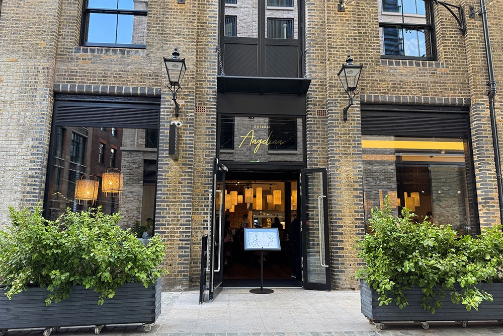 The brick entrance to Osteria Angelina at Nicholls Clarke Yard in Spitalfields