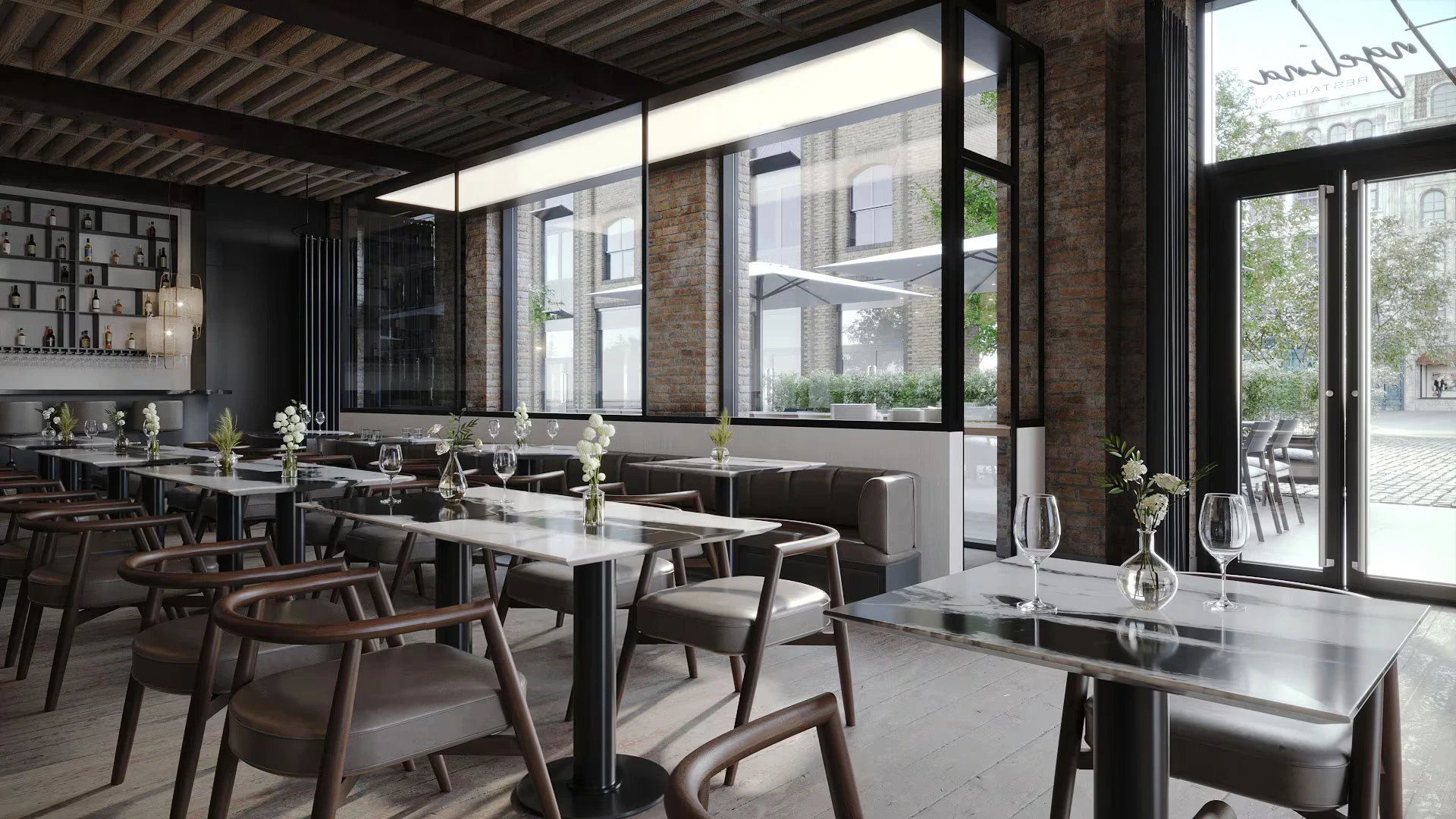 Marble-topped tables and upholstered seating beside Osteria Angelina’s windows